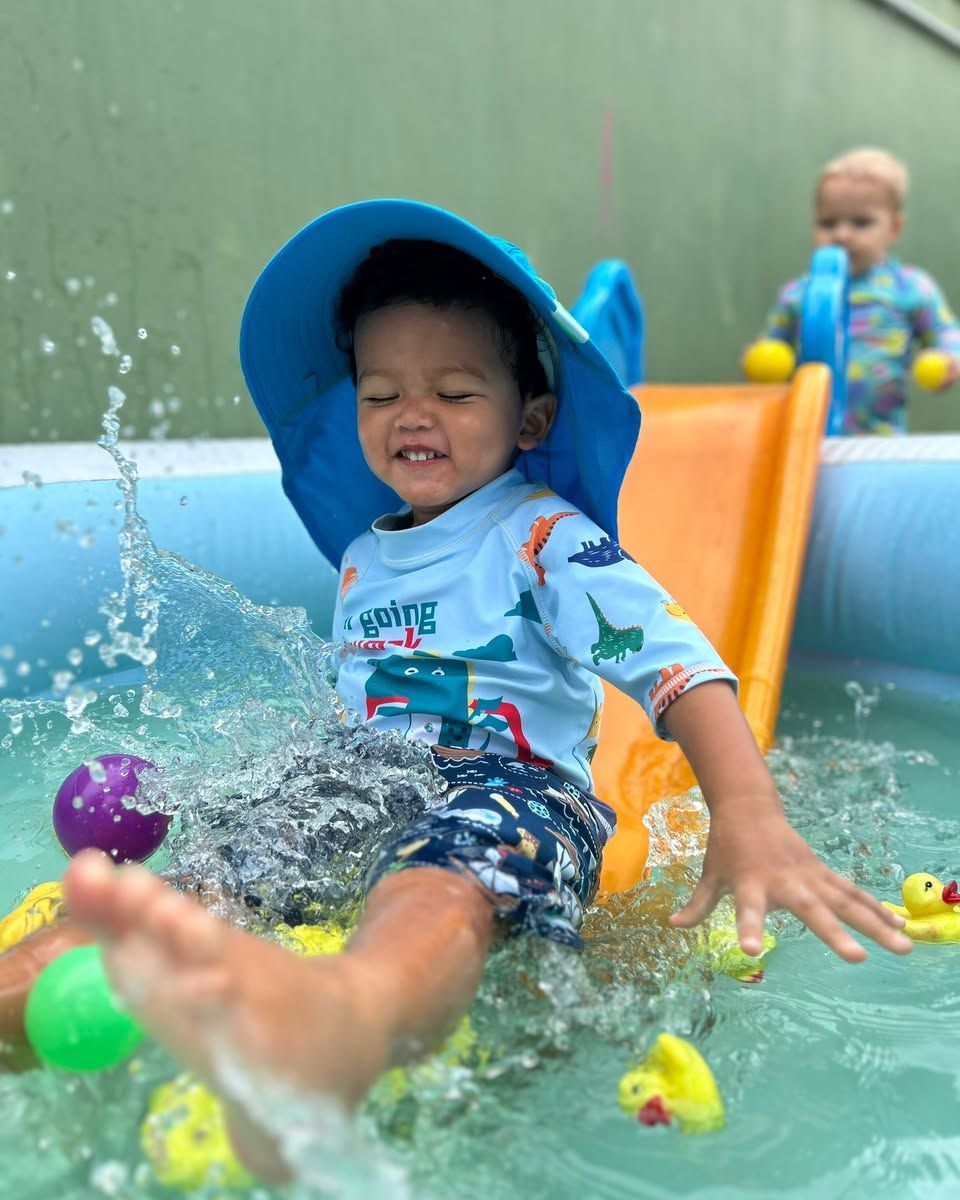 A confident child engaged in messy, hands-on play